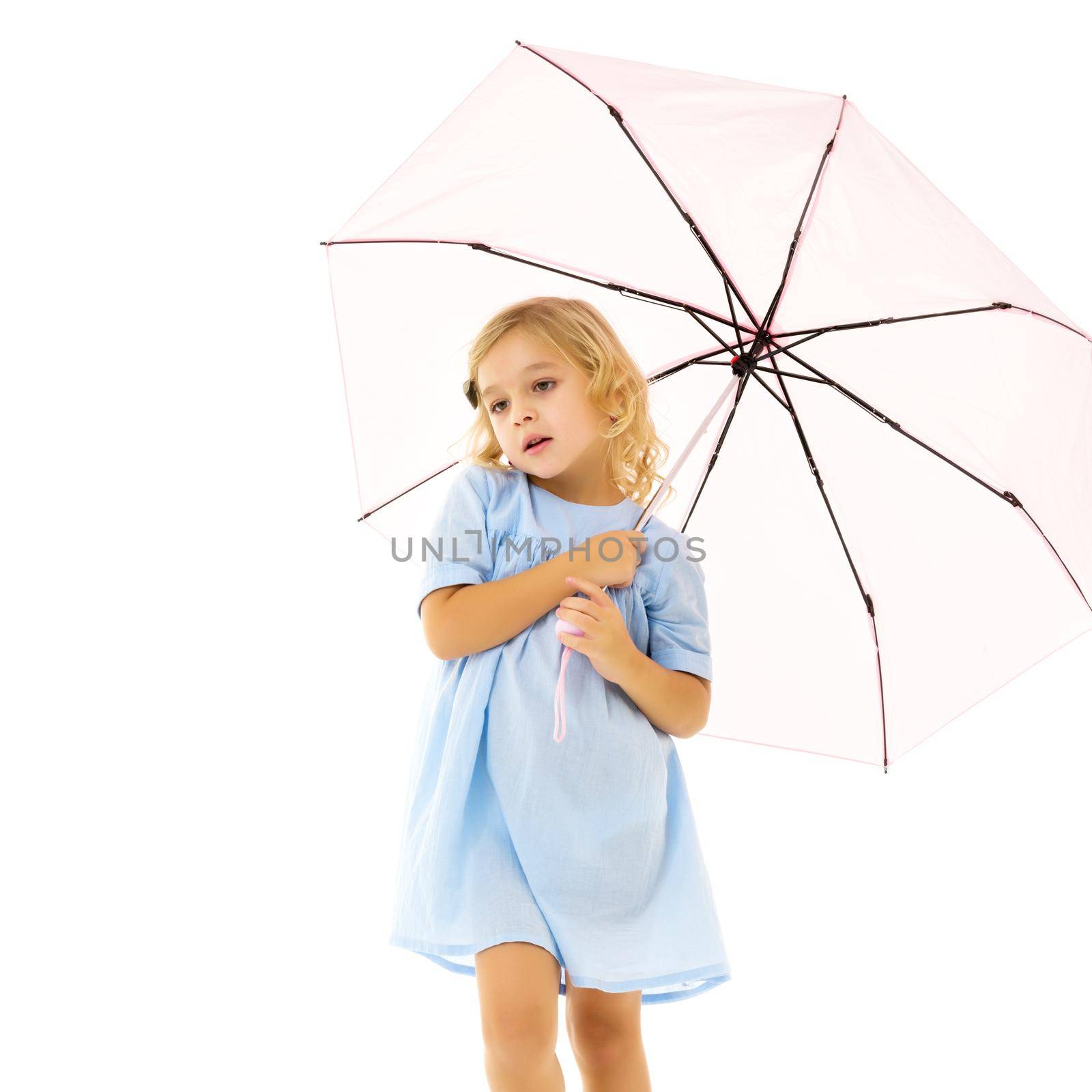 A beautiful little girl hid under an umbrella. The concept of summer vacation, style and fashion. Isolated on white background.