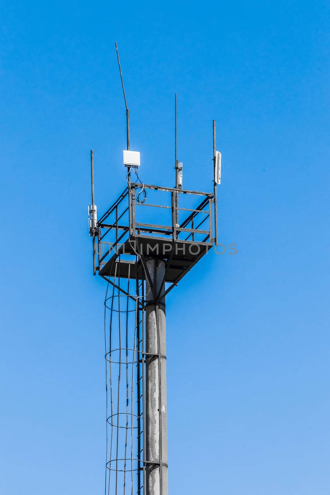 Old steel high-rise outlook tower point architecture view of the open air outdoor blue sky background by AYDO8