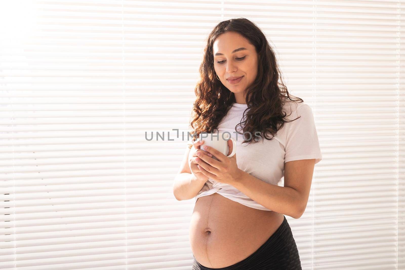 Pregnant woman eating breakfast. Pregnancy and maternity leave.