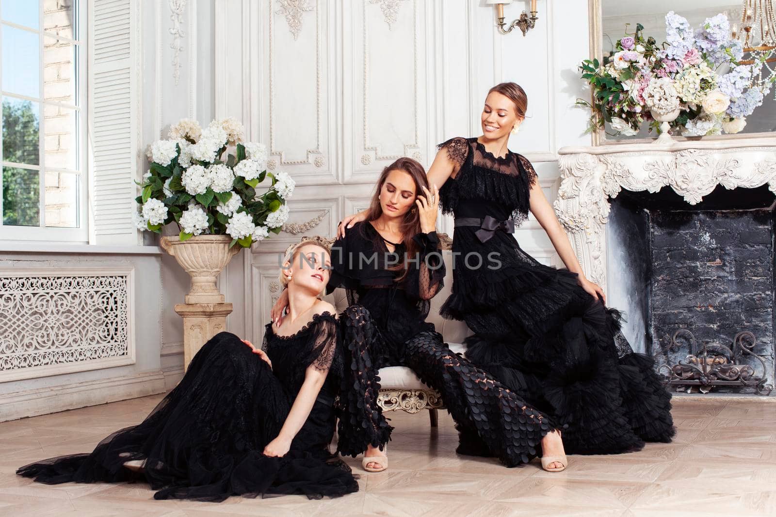 three young pretty lady in black lace fashion style dress posing in rich interior of royal hotel room, luxury lifestyle people concept by JordanJ