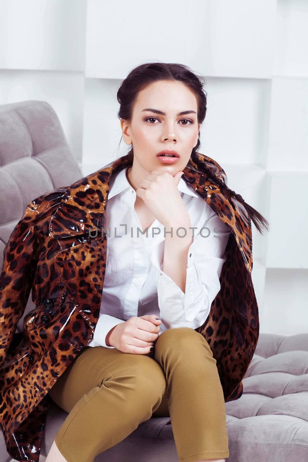 pretty stylish woman in fashion dress with in luxury rich room interior, lifestyle people concept, modern brunette close up