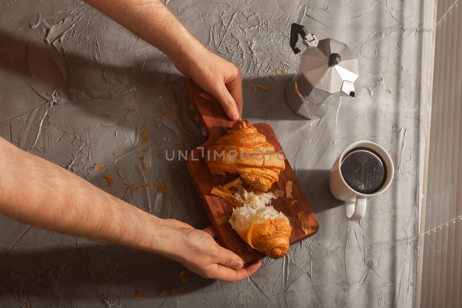 Breakfast with croissant on cutting board and black coffee. Morning meal and breakfast concept. by Satura86