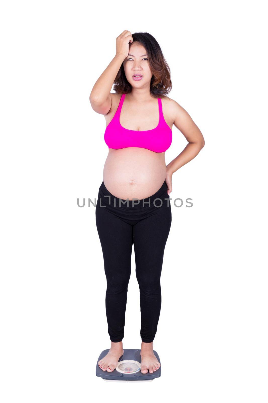 Worried pregnant woman on scale isolated on white background