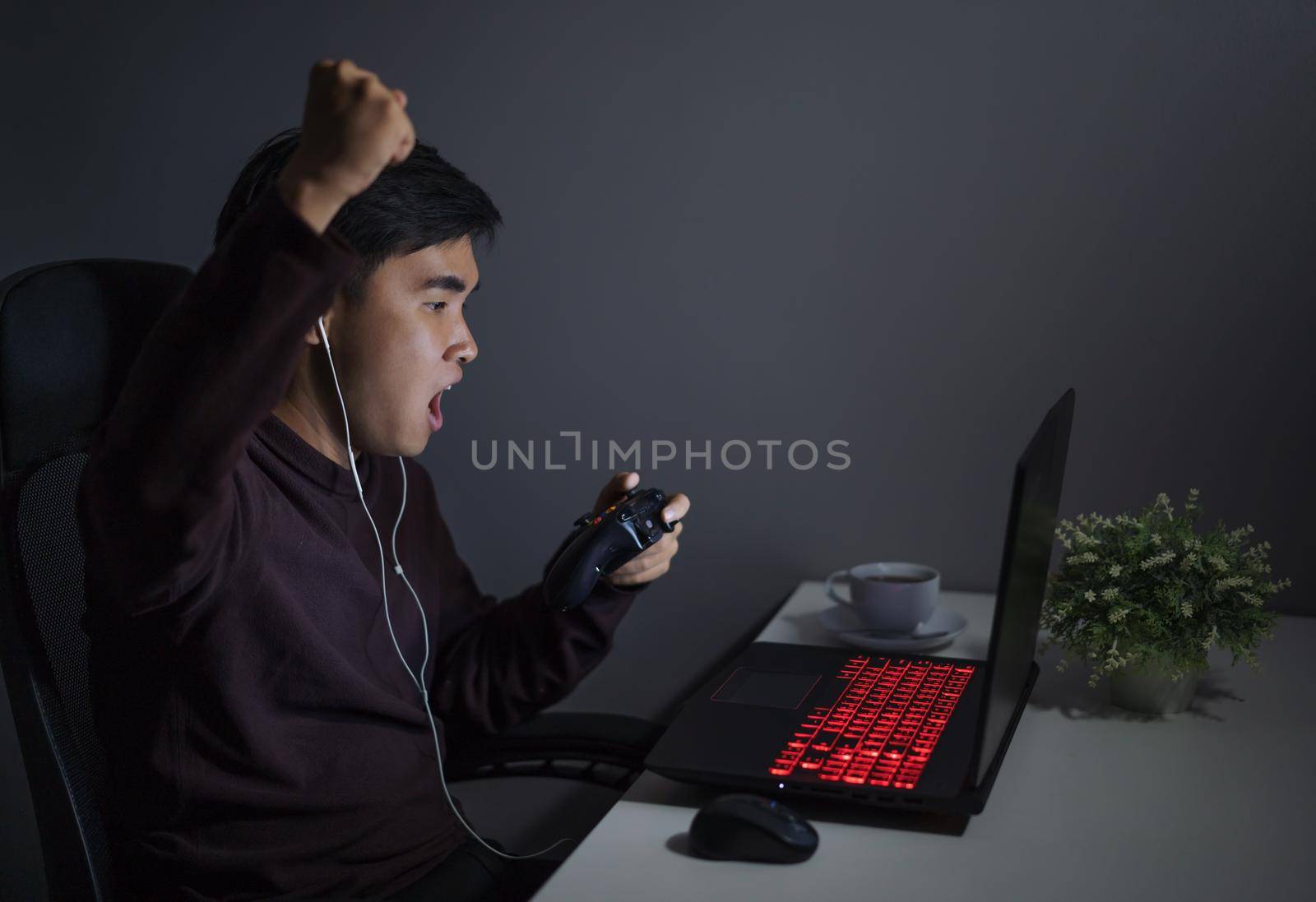 happy man using joystick to playing games by geargodz