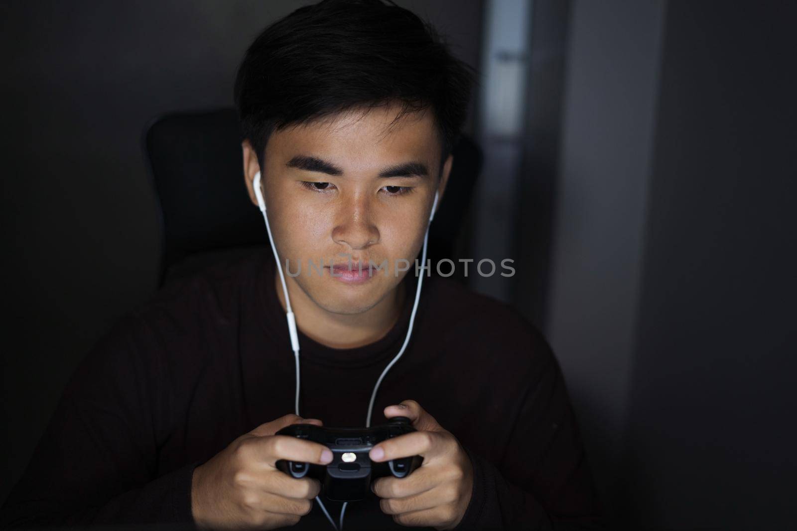 happy young man using joystick to playing games