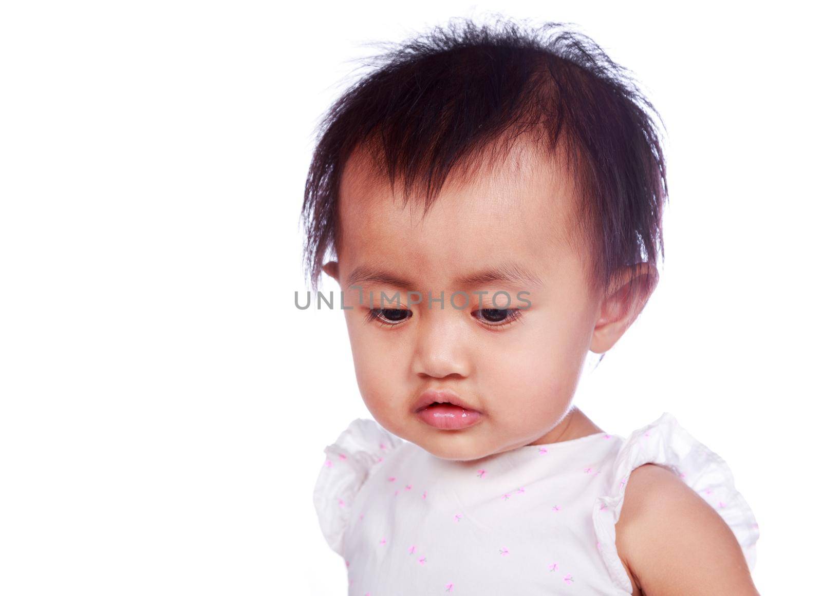 close up face of baby isolated on white background by geargodz