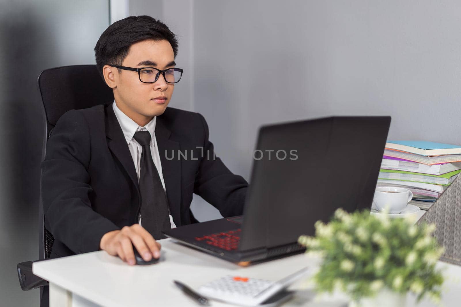 business man using laptop computer by geargodz