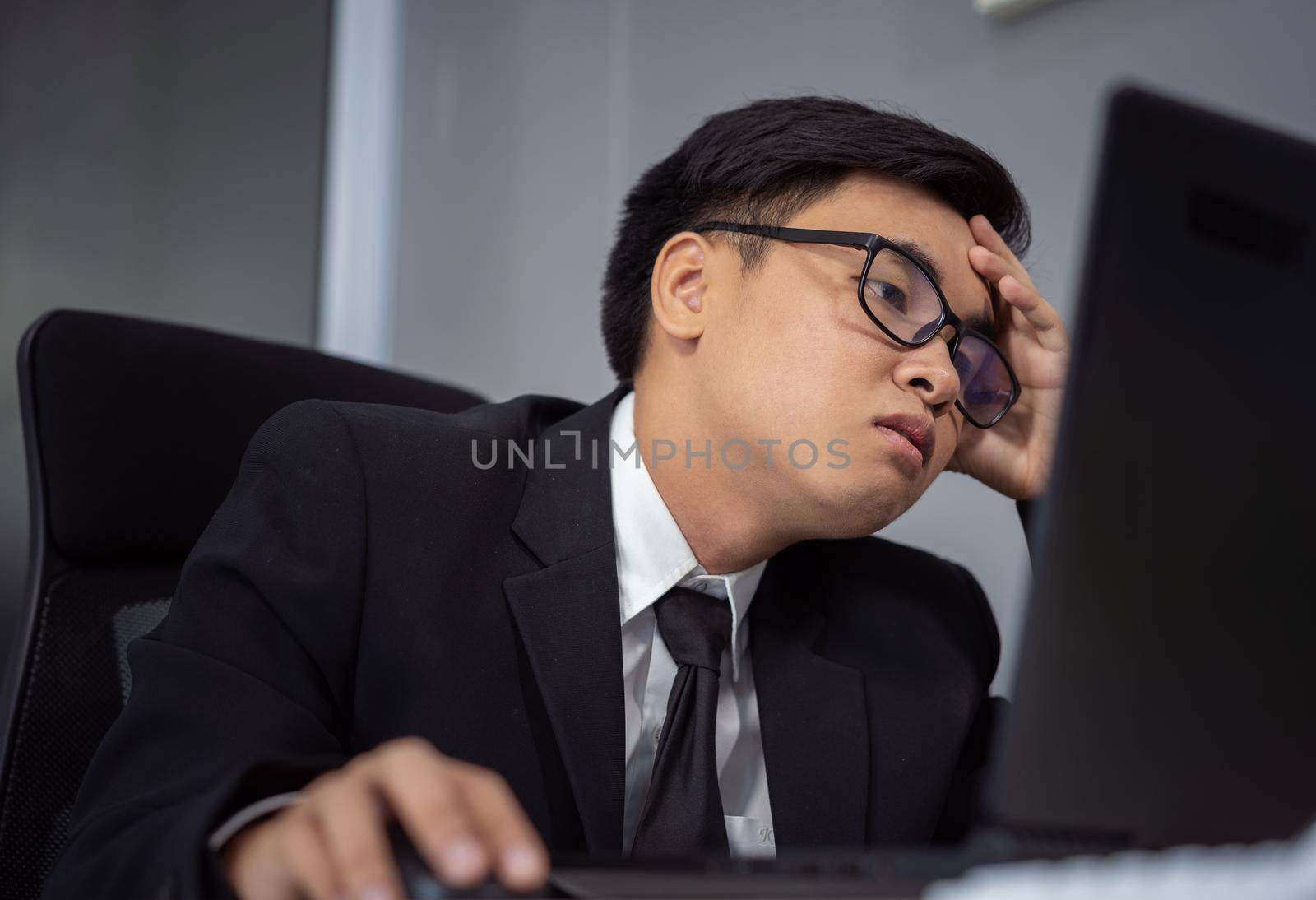 young business man working problem using laptop