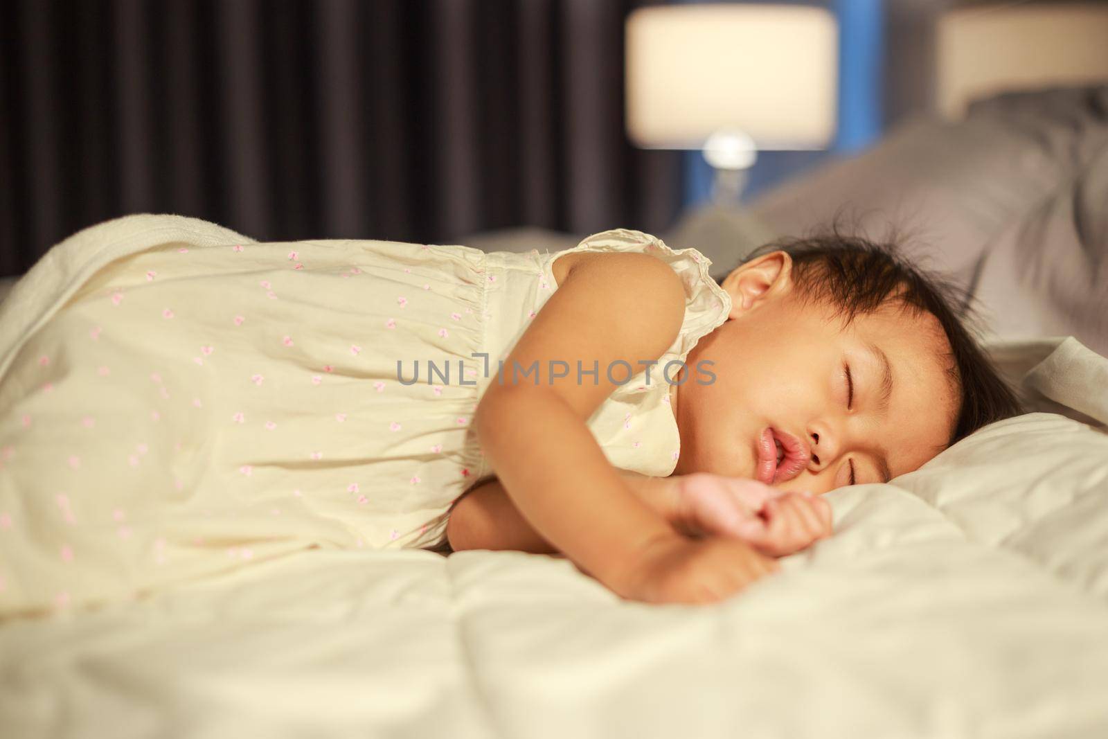 baby sleeping on bed at home by geargodz