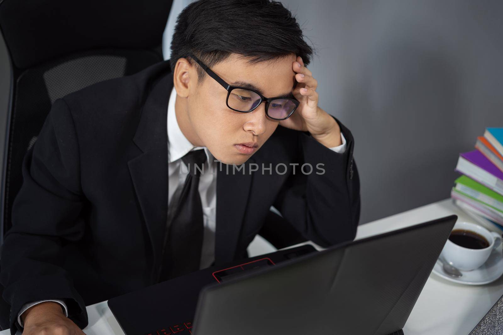 young business man working problem using laptop