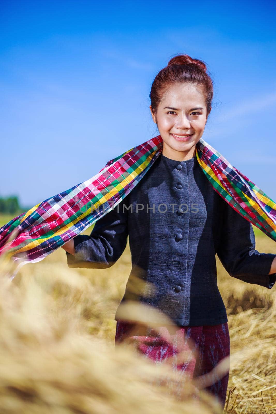 beautiful farmer woman with the straw in field, Thailand