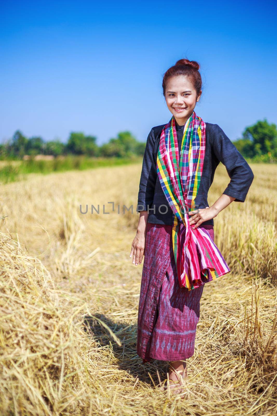 beautiful farmer woman with the straw in field, Thailand