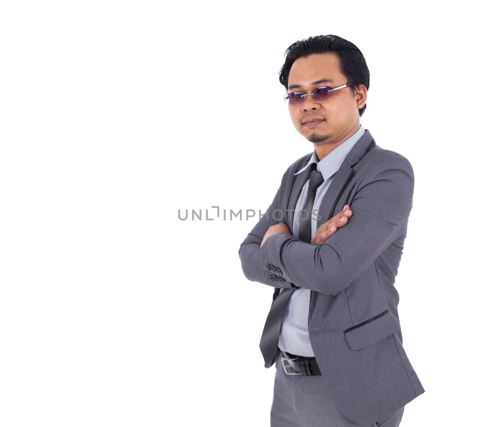 business man in suit with arms crossed isolated on white background by geargodz