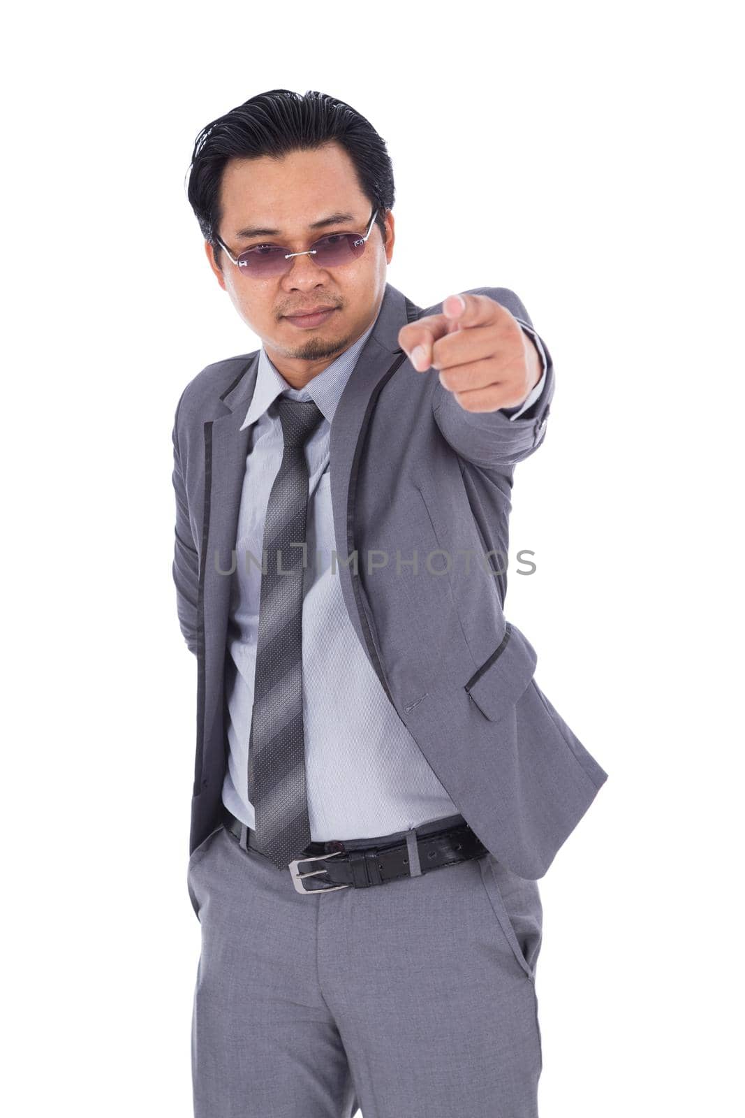 business man pointing isolated on white background by geargodz