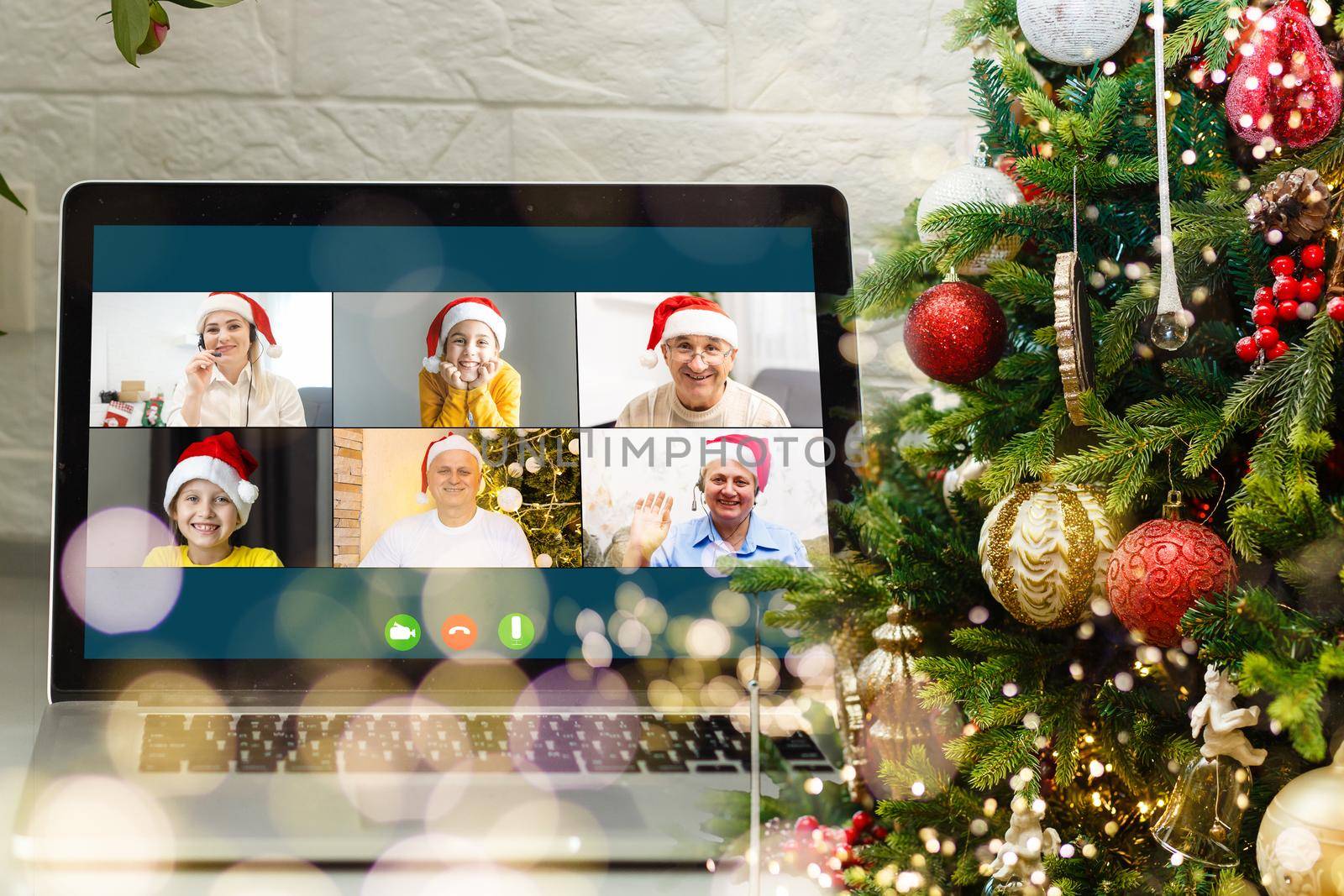 Virtual Christmas meeting team teleworking. Family video call remote conference Computer webcam screen view. Diverse portrait headshots meet working from their home offices. Happy hour party online. by Andelov13