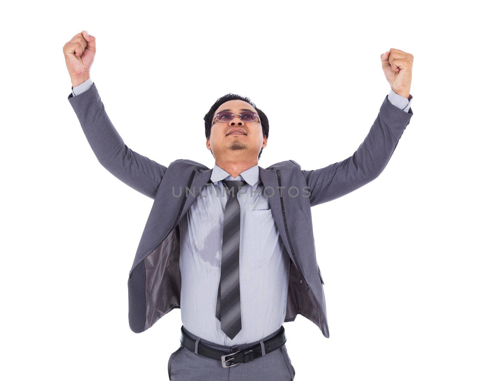 winner business man in suit with arms raised isolated on a white background