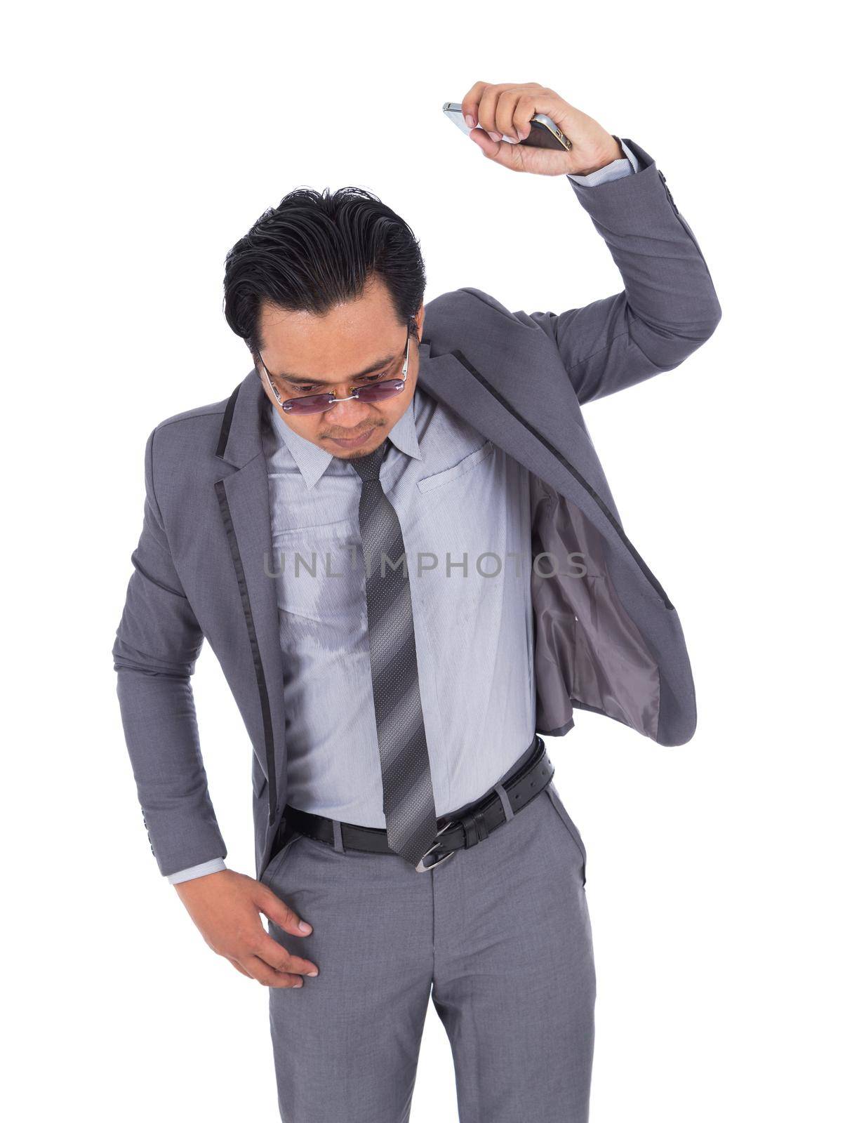 very angry businessman is throwing away his mobile phone isolated on white background by geargodz