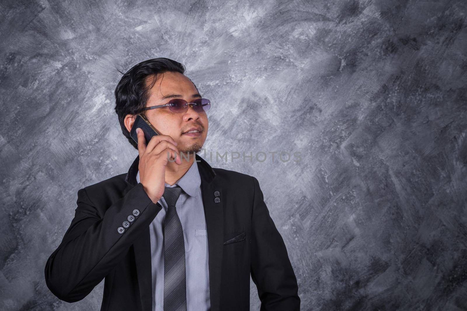 business man using a mobile phone  by geargodz