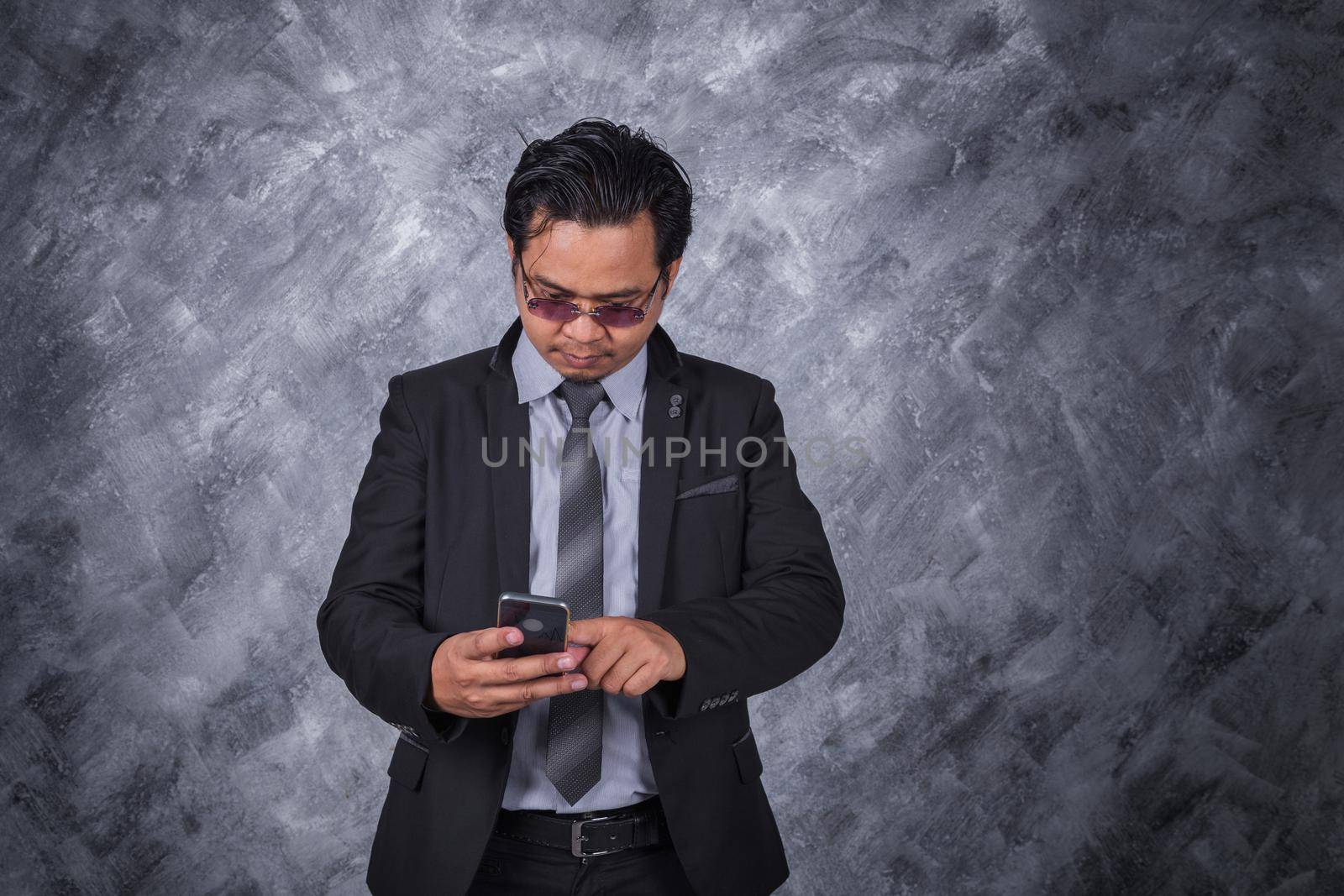 business man using mobile phone  by geargodz