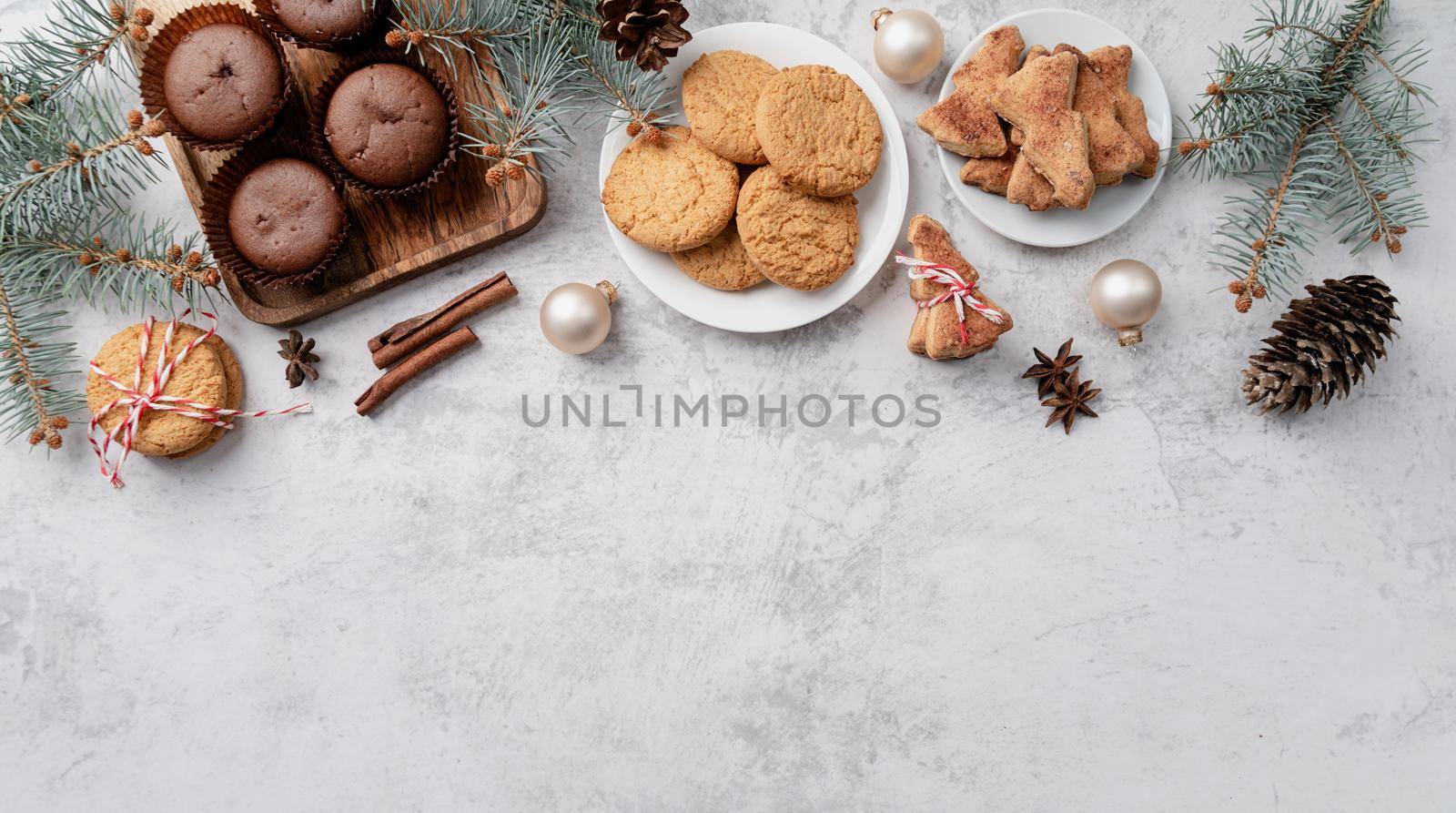 top view christmas cookies, muffins and gingerbread flay lay with copy space