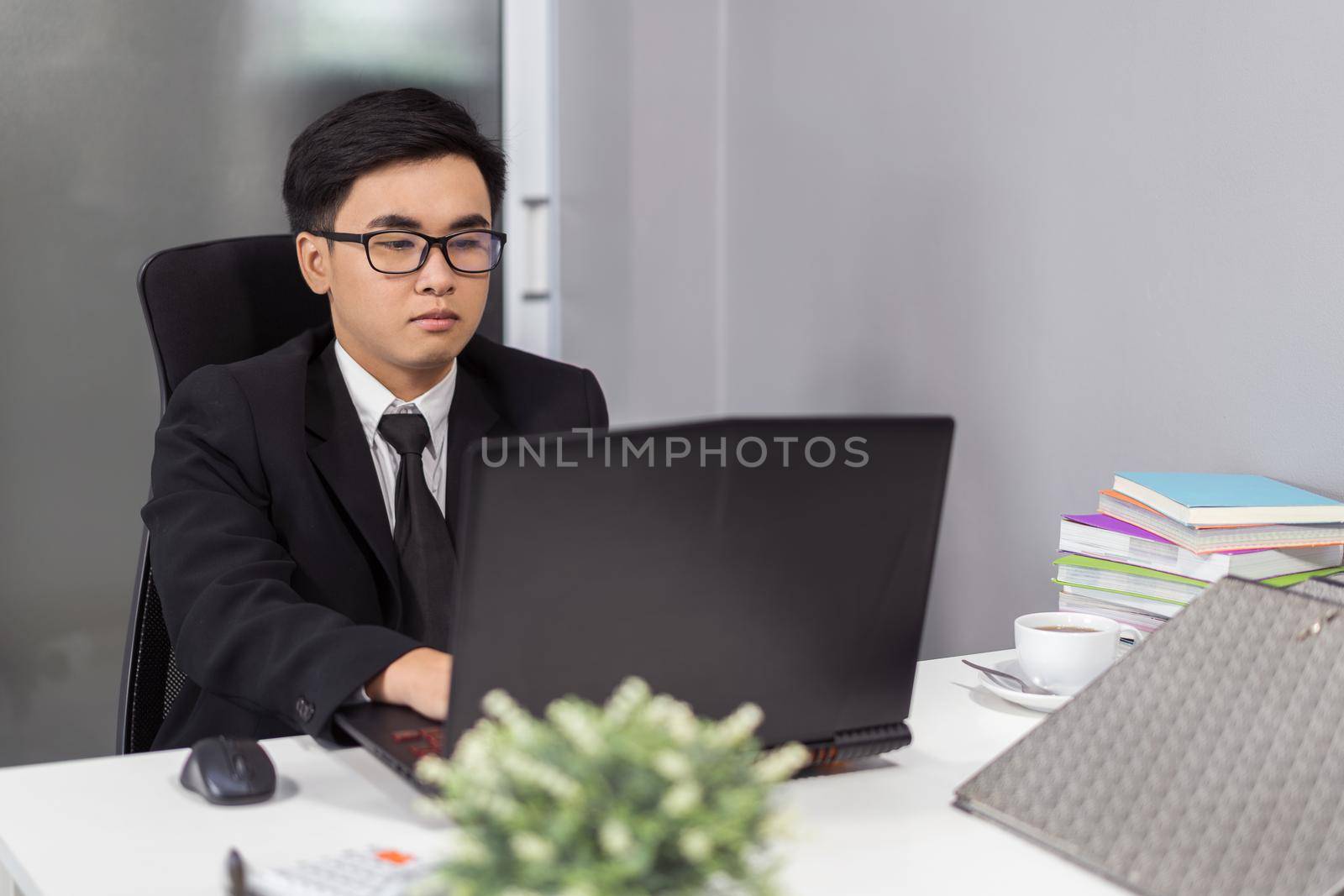 young business man using laptop computer
