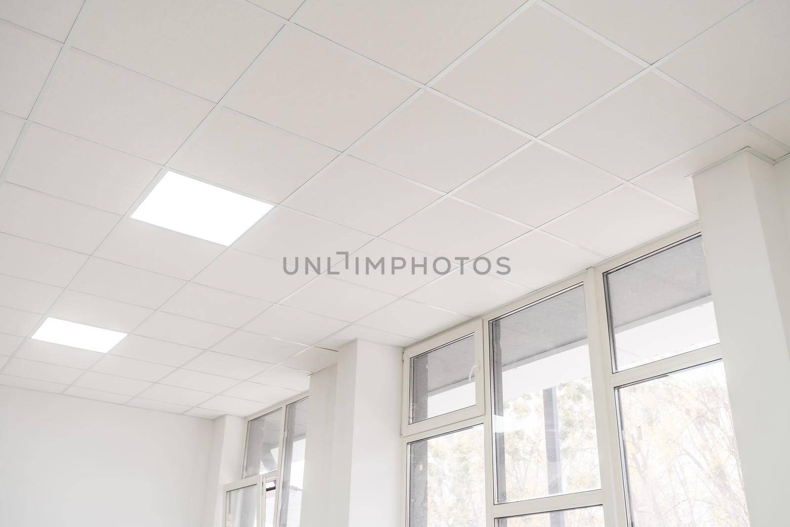 Acoustic ceiling with lighting and light channel window, Acoustic ceiling board texture Sound-proof material, Sound absorber, industry construction concept background black and white tone.