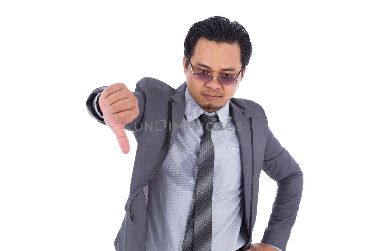 business man in suit with thumb down isolated on white background by geargodz