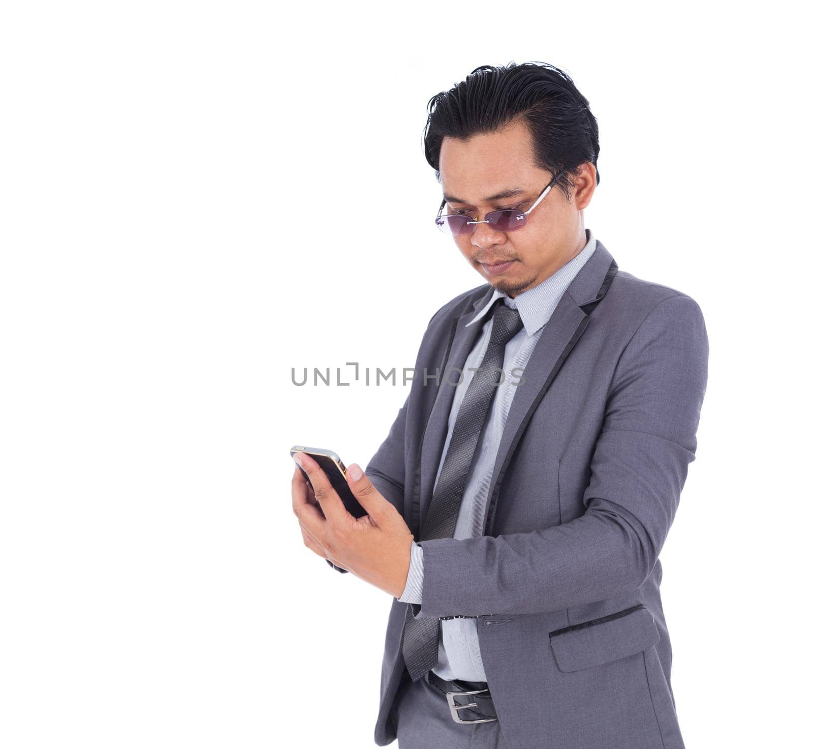 business man using mobile phone isolated on white background by geargodz