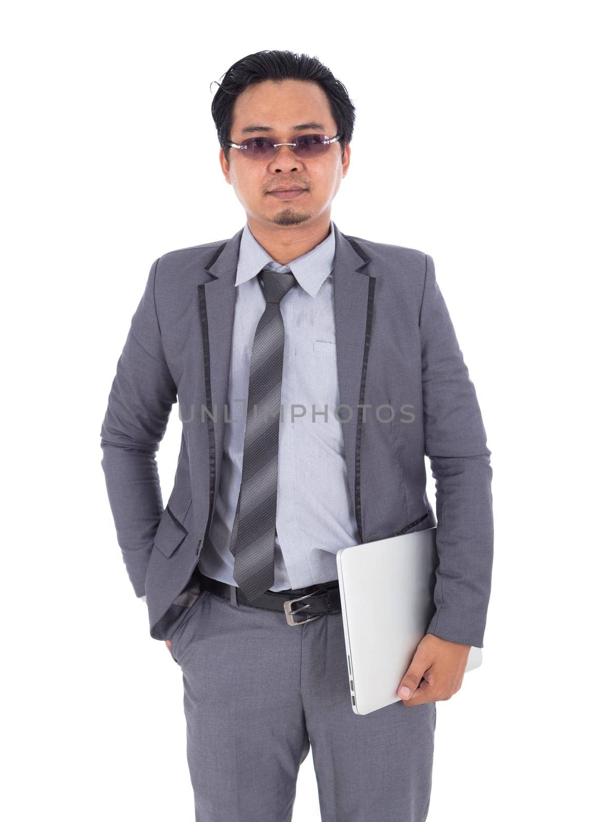 business man holding laptop isolated on white background by geargodz