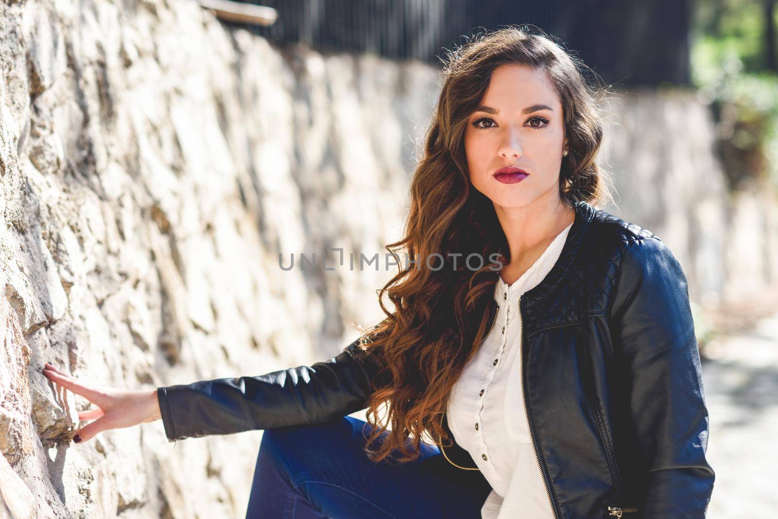 Girl with long hair wearing leather jacket by javiindy