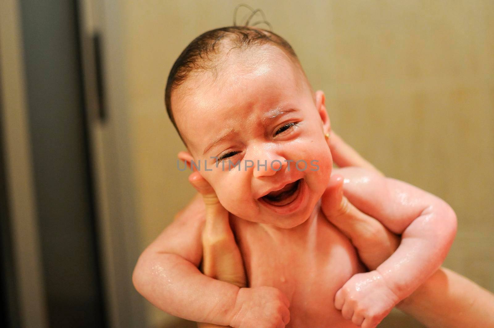 Baby girl two months old having her bath by javiindy
