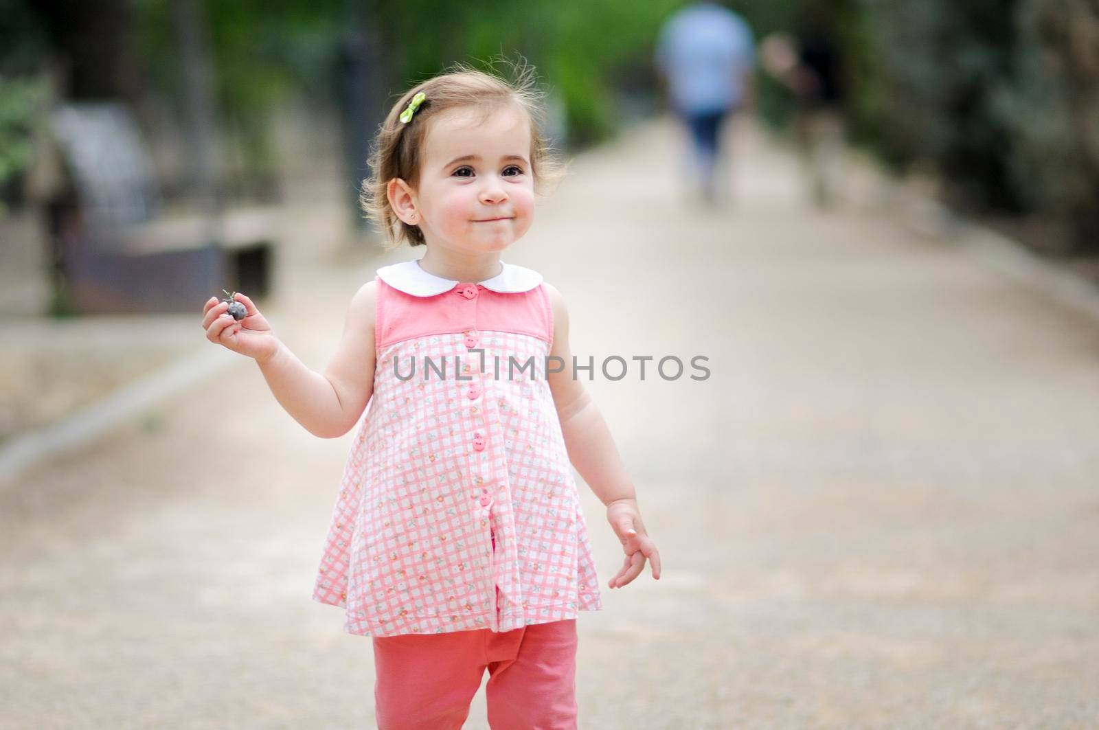 Little girl playing in a urban park by javiindy