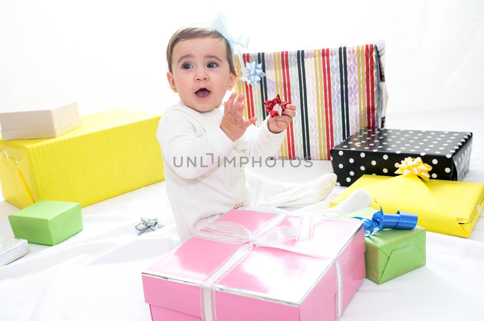 Portrait of a baby girl with gifts