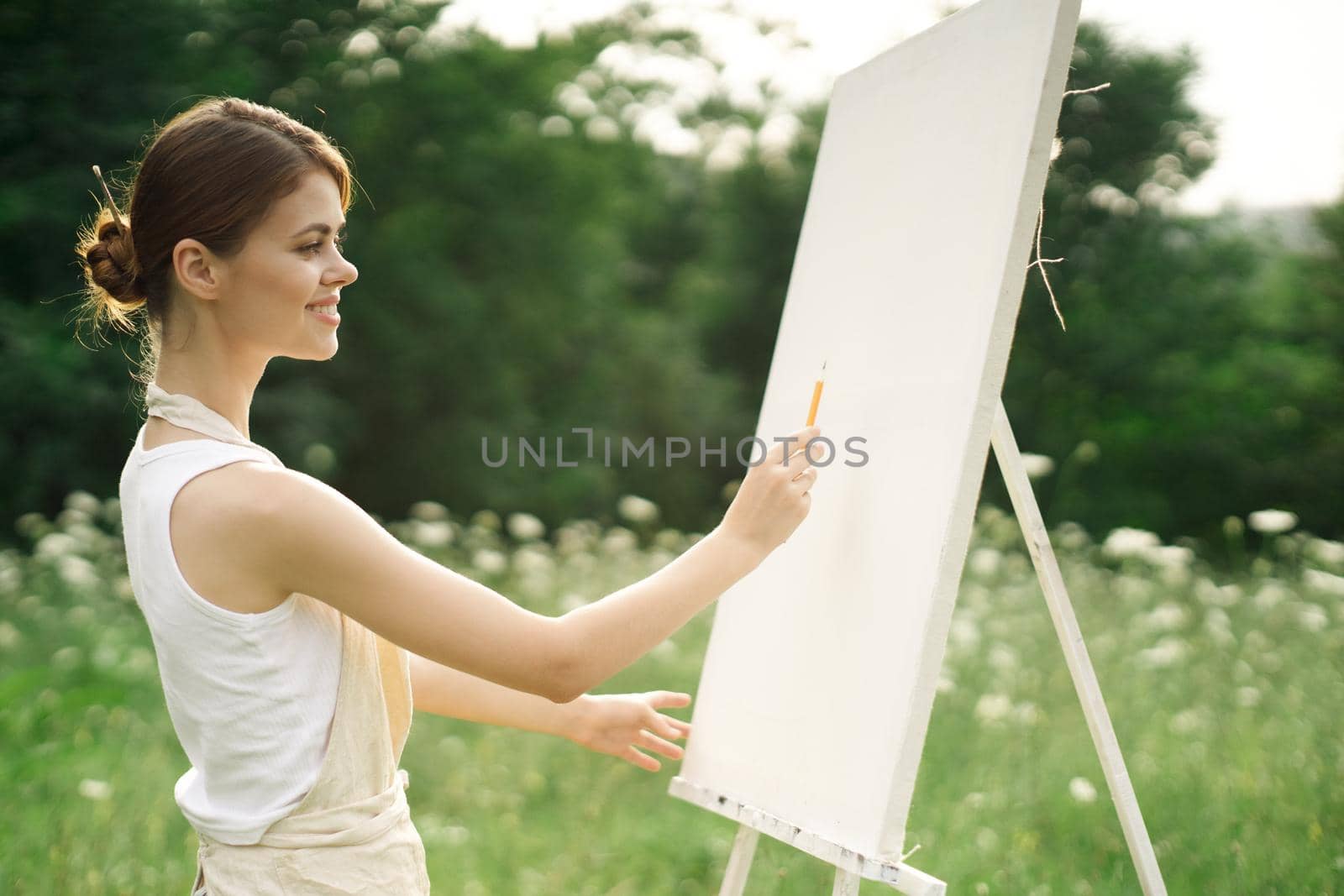 woman artist nature drawing landscape art hobby. High quality photo