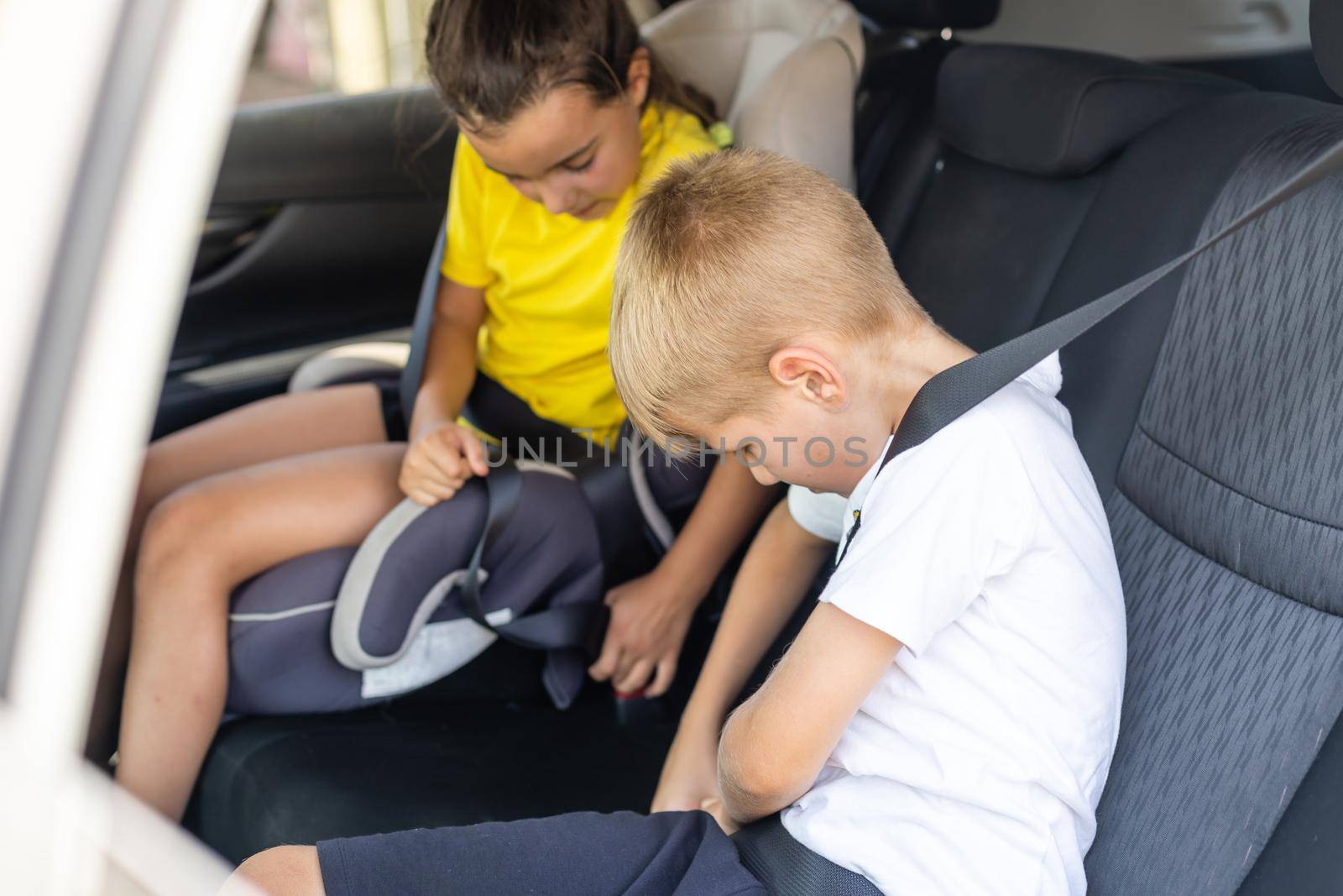 Cute children in car, boy and girl in the car