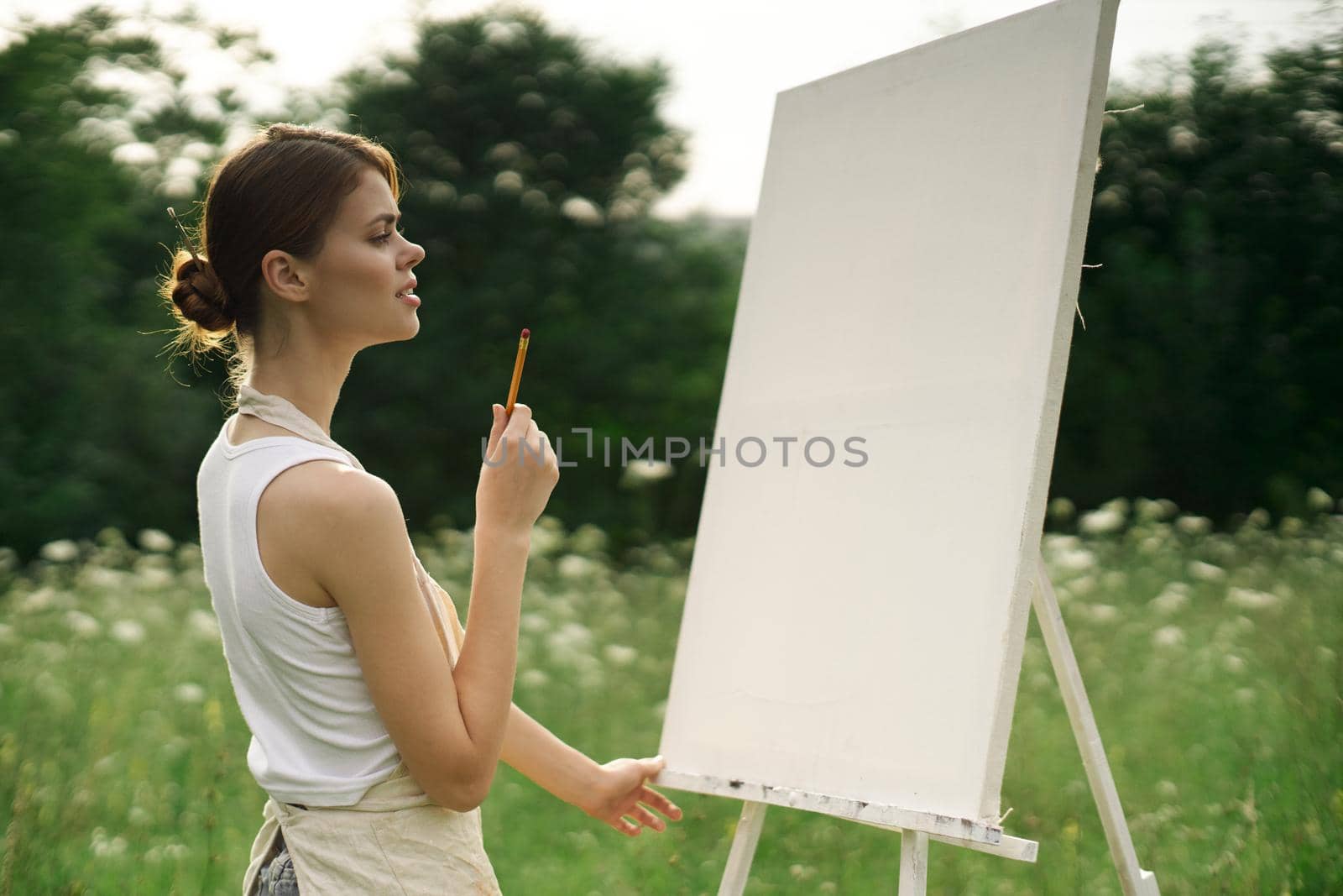 woman artist nature drawing landscape art hobby. High quality photo