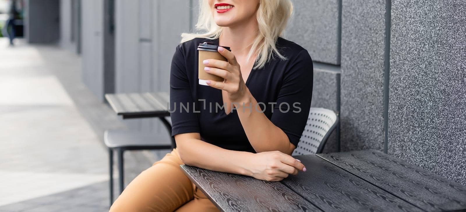 woman in a cafe drinking coffee.
