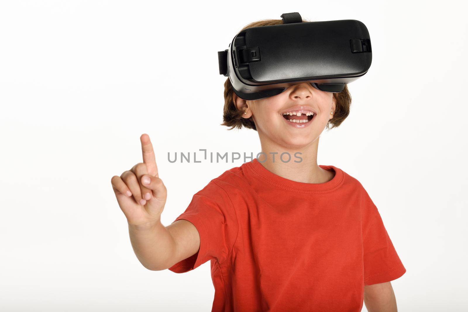Little girl looking in VR glasses and gesturing with his hands. by javiindy