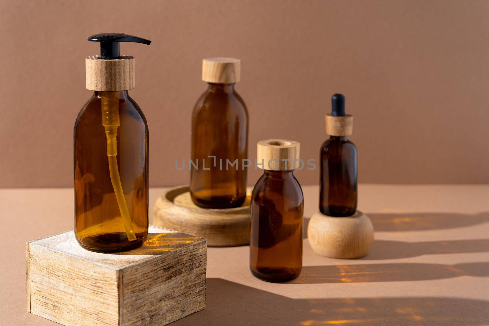 Eco friendly bottles for cosmetics. Glass bottle with a wooden lid with a dispenser and a pipette. Beauty and skin care. Brand packaging, place for text. Bottle products. Minimalism concept. by A_Gree