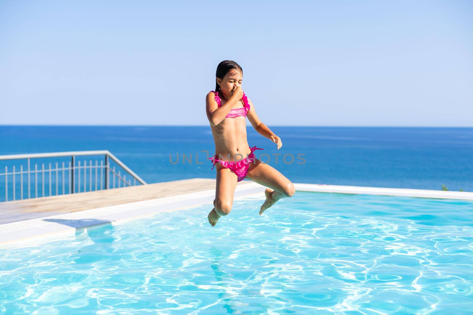happy girl in the swimming in swimming suit