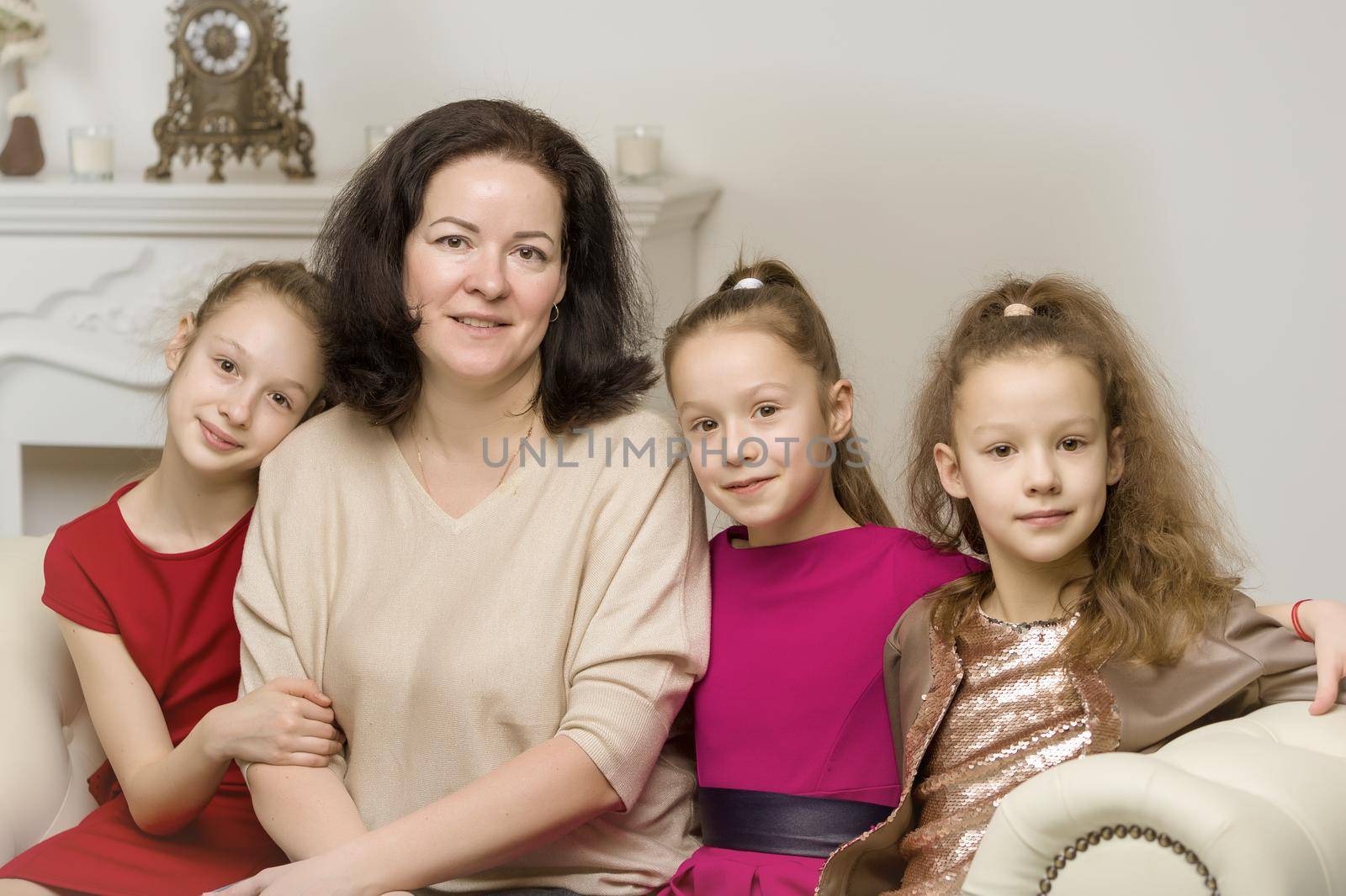 Studio Portrait of Happy Family of Mother and Three Daughters by kolesnikov_studio