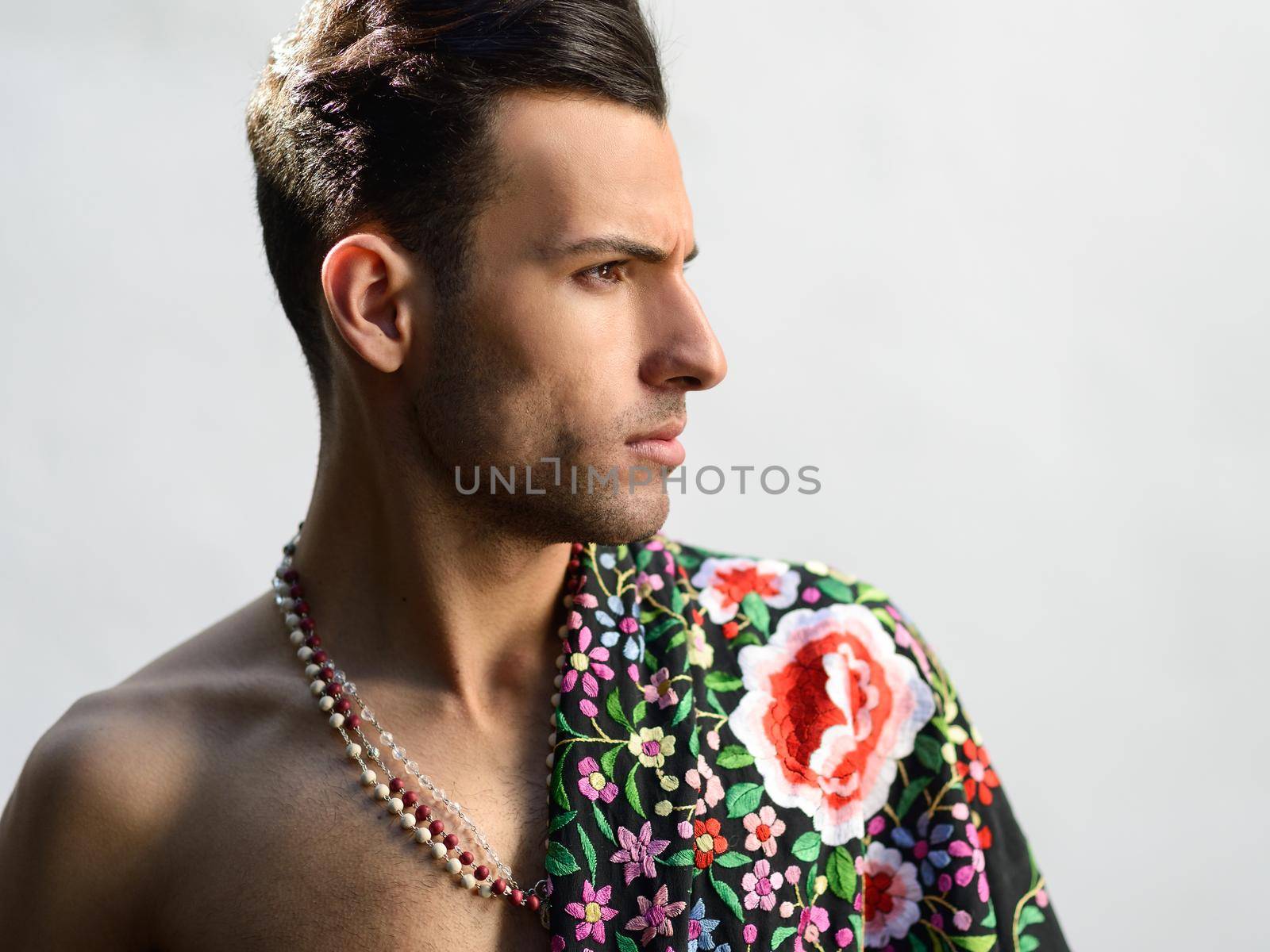 Portrait of attractive man, model of fashion, wearing spanish clothes