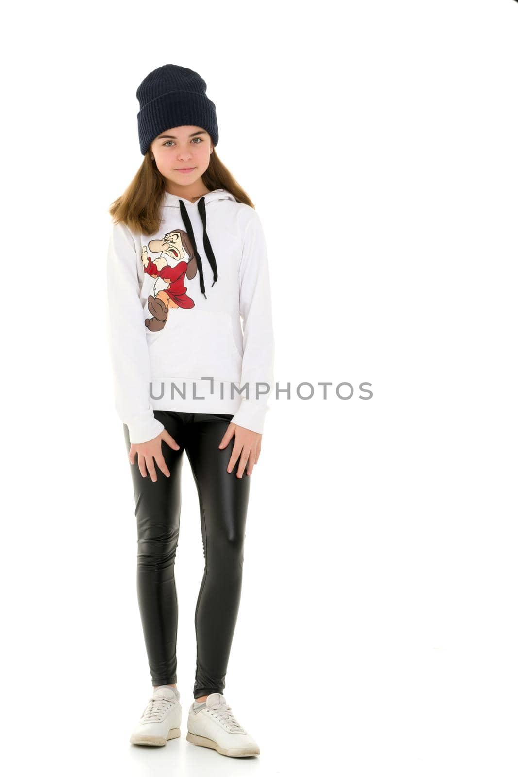 Portrait of a gymnast girl in a tracksuit. Isolated on white background