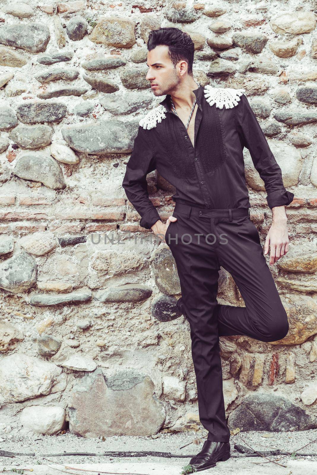 Portrait of attractive man, model of fashion, wearing spanish clothes