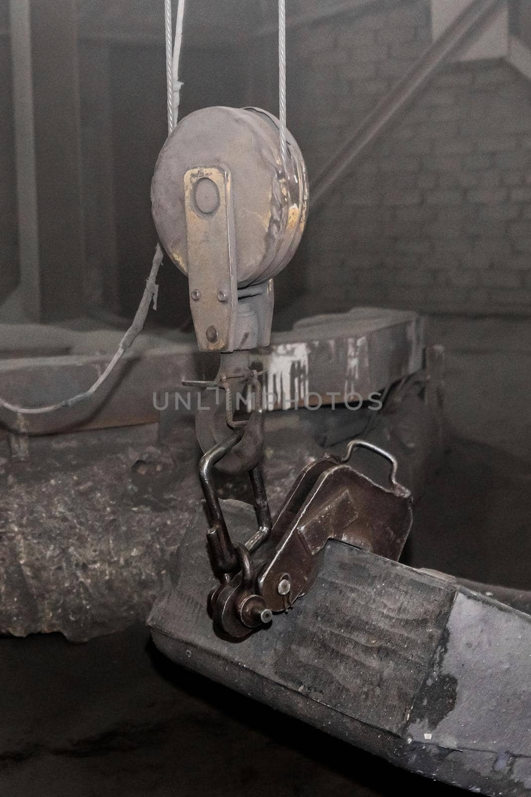 Attache an iron hook of a lifting mechanism to cast-iron tubing reinforced concrete structures made of cast products at an industrial plant by AYDO8