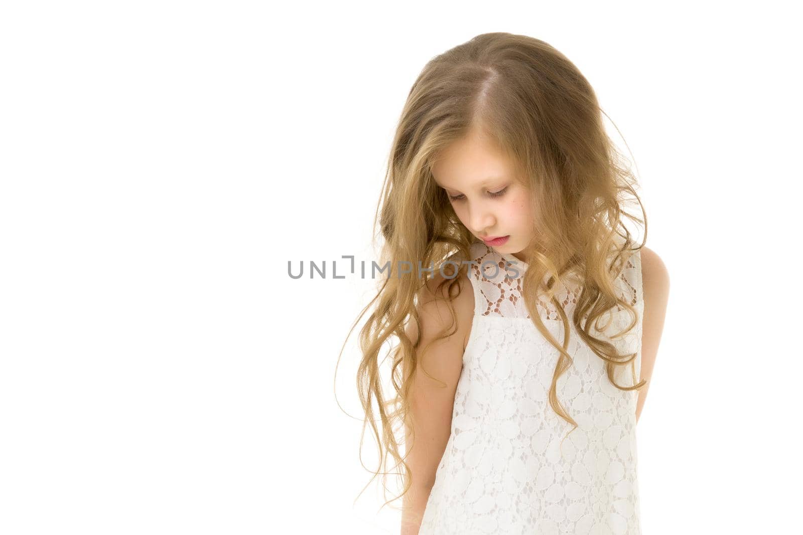 Beautiful little girl close-up. The concept of beauty and fashion, happy childhood. Isolated on white background.