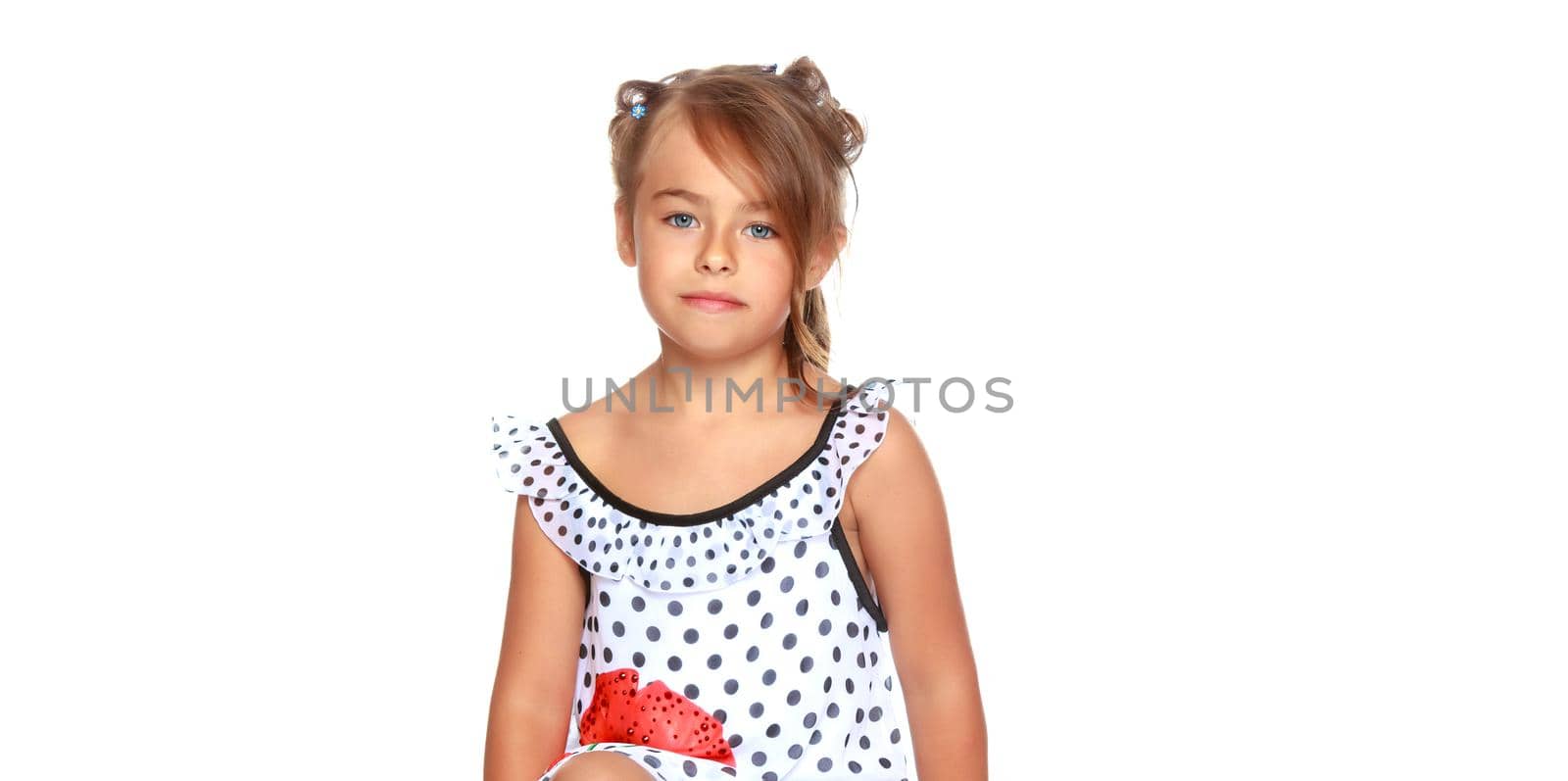 Beautiful little girl close-up. The concept of beauty and fashion, happy childhood. Isolated on white background.