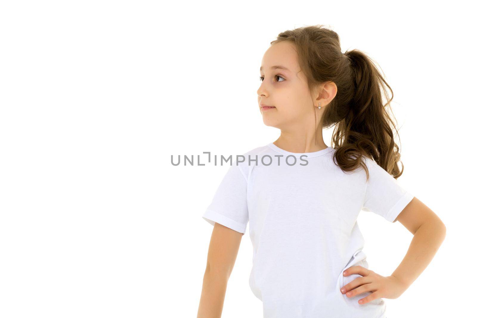 Close-up portrait of a little girl in a clean white t-shirt. You can put a logo or any other inscription on the shirt.