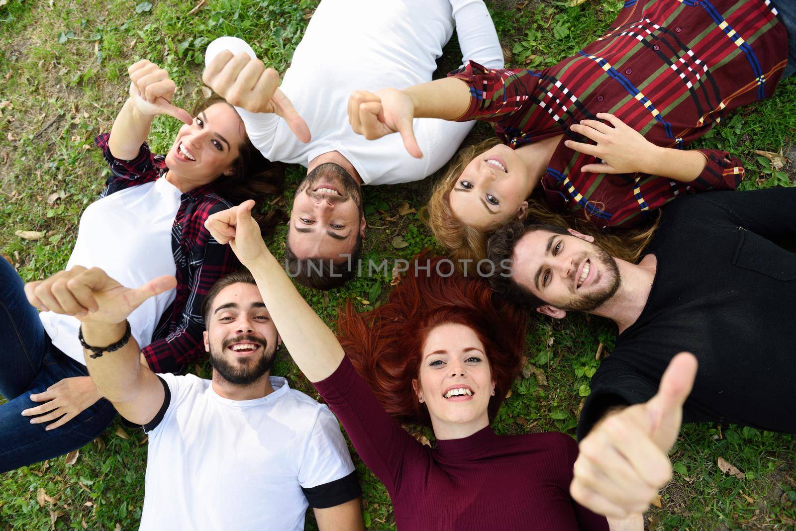 Group of young people together outdoors in urban background by javiindy