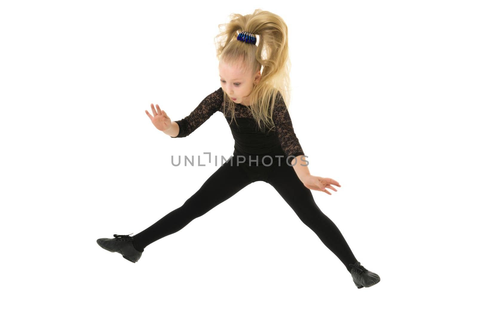 Girl gymnast jumping.The concept of a good mood. by kolesnikov_studio